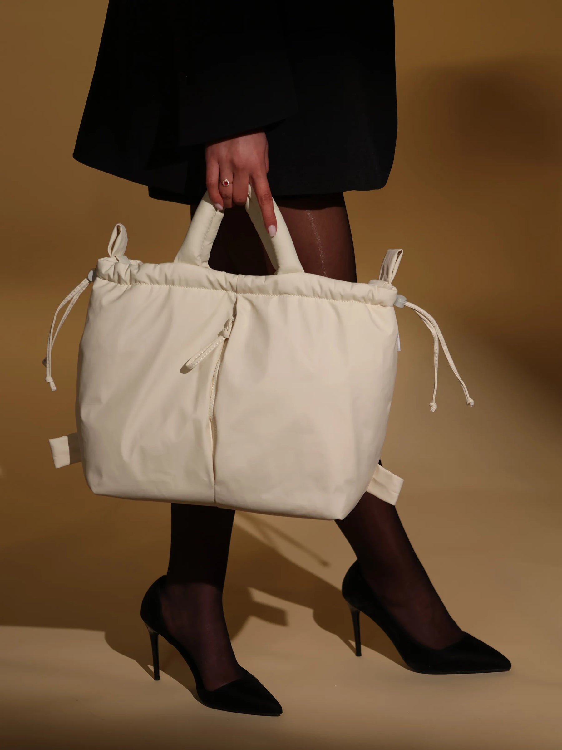 PUFFLE JOY Bag styled in an editorial portrait